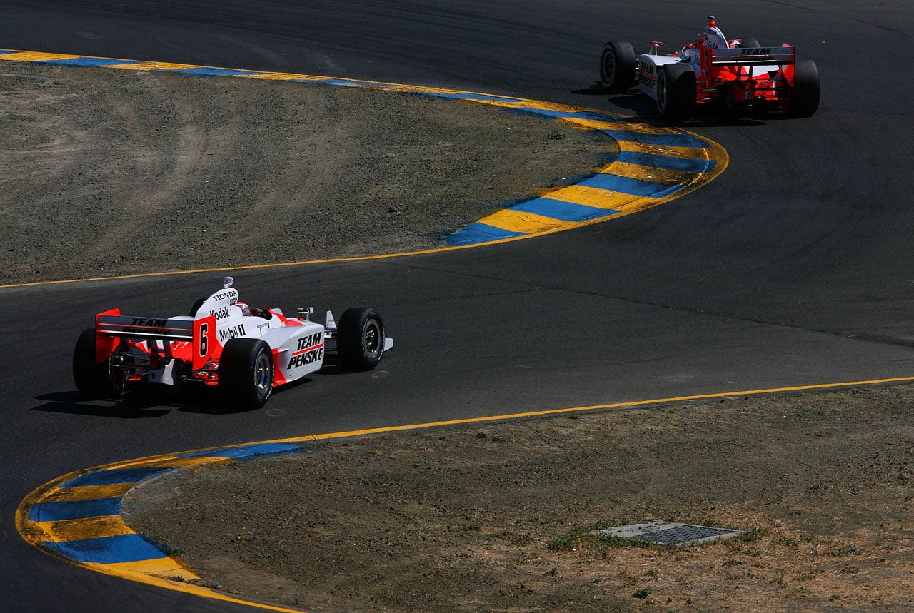 SONOMA, CA - AUGUST 24: Helio Castroneves drives the #3 Team Penske Dallara Honda ahead of teammate Ryan Briscoe #6 during the IRL IndyCar Series PEAK Antifreeze & Motor Oil Indy Grand Prix of Sonoma County on August 24, 2008 at the Infineon Raceway in Sonoma, California. (Photo by Darrell Ingham/Getty Images)