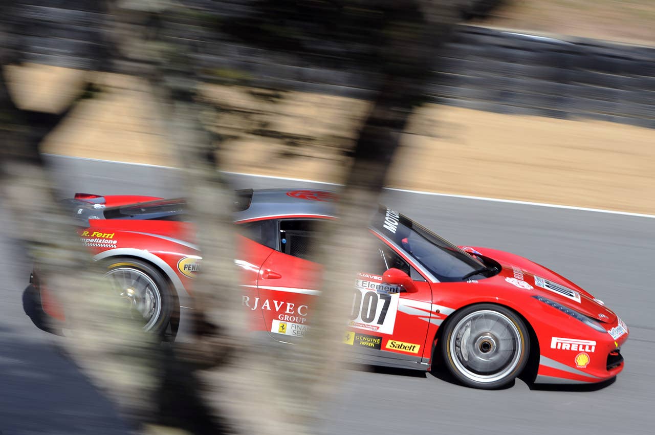 Ferrari 458 Challenge  Article:Ferrari 458 Challenge demonstrates evolution of the breed on Laguna Seca's Corkscrew  Copyright 2011Drew Phillips / AOL