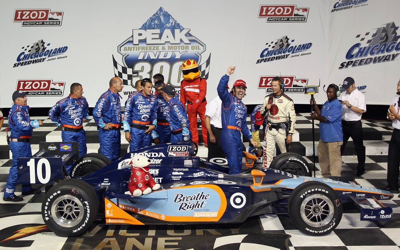 CHICAGO - AUGUST 28:  Dario Franchitti of Scotland, driver of the #10 Breathe Right Target Chip Ganassi Racing Dallara Honda, celebrates after winning the IndyCar Series PEAK Antifreeze and Motor Oil Indy 300 at Chicagoland Speedway on August 28, 2010 in Chicago, Illinois.  (Photo by Streeter Lecka/Getty Images) *** Local Caption *** Dario Franchitti