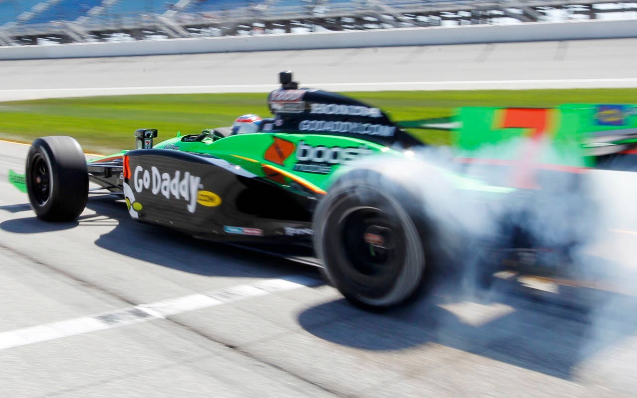 Danica Patrick talks off for her qualifying run for the Peak Antifreeze and Motor Oil Indy 300 at Chicagoland Speedway in Joliet, Ill., Friday, Aug. 27, 2010.  (AP Photo/Skip Stewart)
