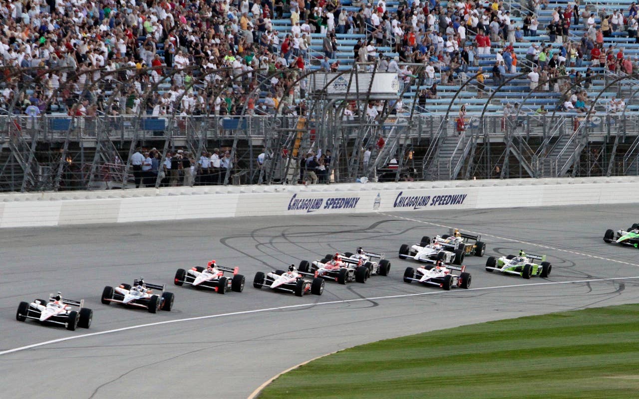 IRL Drivers cross the start line during  the Peak Antifreeze and Motor Oil Indy 300 auto race at ChicagoLand Speedway in Joliet, Ill., Saturday, Aug. 28, 2010. (AP Photo/Nam Y. Huh)
