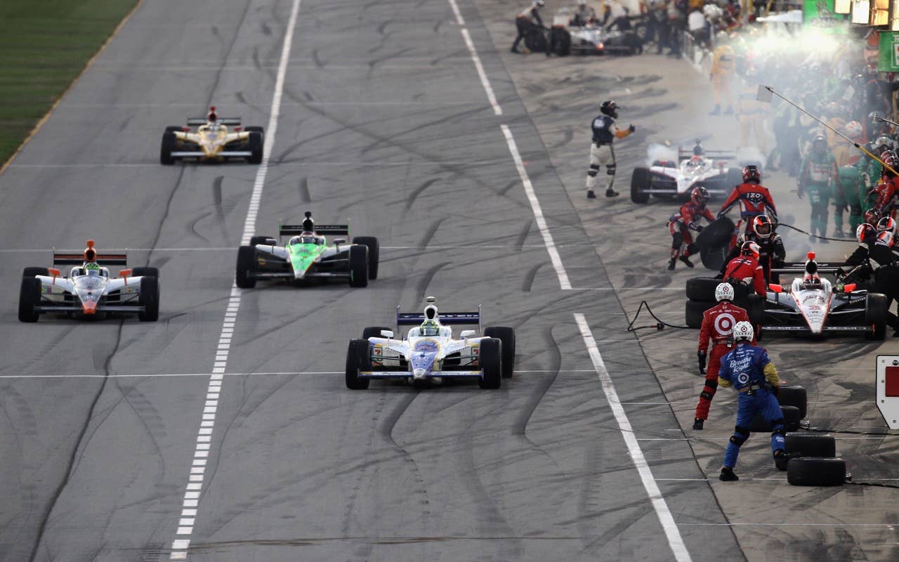 CHICAGO - AUGUST 28:  A general view of pit road during a pit stop for the IndyCar Series PEAK Antifreeze and Motor Oil Indy 300 at Chicagoland Speedway on August 28, 2010 in Chicago, Illinois.  (Photo by Streeter Lecka/Getty Images)