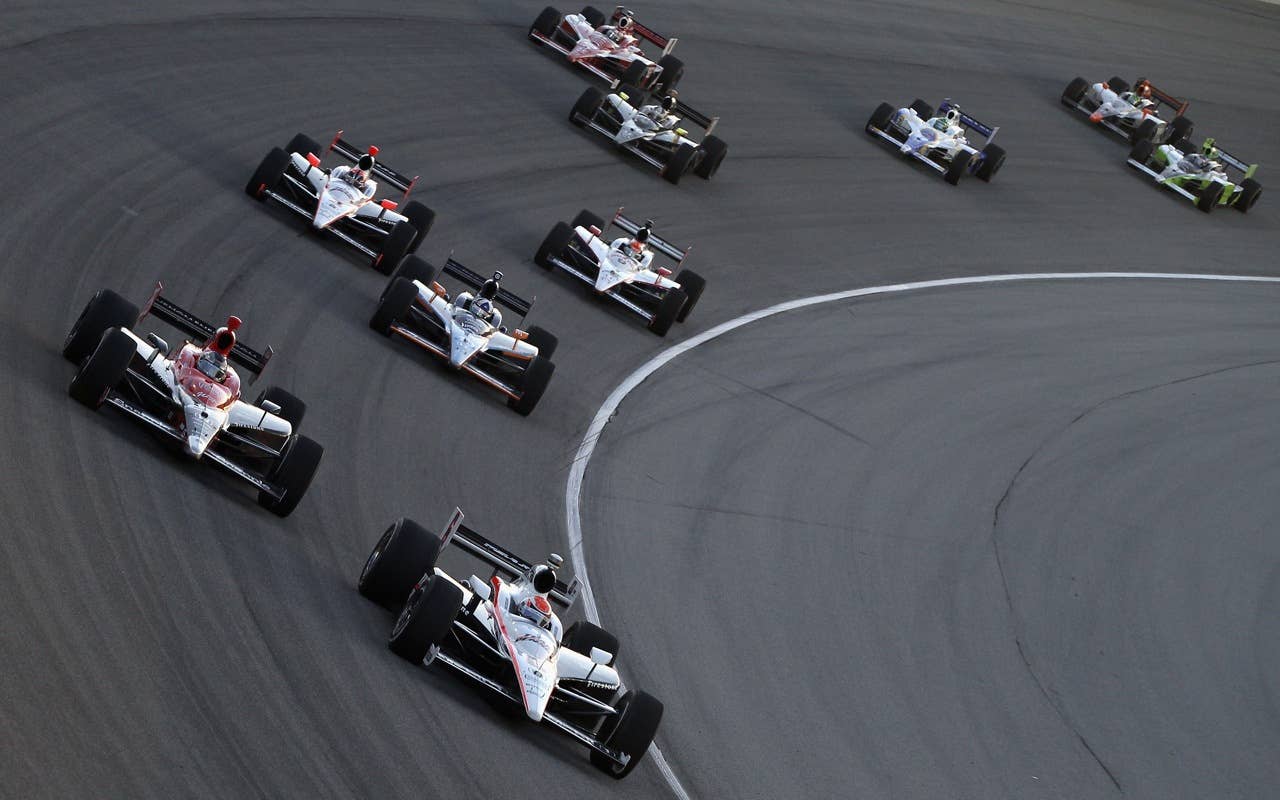 CHICAGO - AUGUST 28:  Ryan Briscoe, driver of the #6 Team Penske Dallara Honda,  leads Marco Andretti, driver of the #26 Team Venom Energy Andretti Autosport Dallara Honda, during the IndyCar Series PEAK Antifreeze and Motor Oil Indy 300 at Chicagoland Speedway on August 28, 2010 in Chicago, Illinois.  (Photo by Streeter Lecka/Getty Images) *** Local Caption *** Ryan Briscoe;Marco Andretti