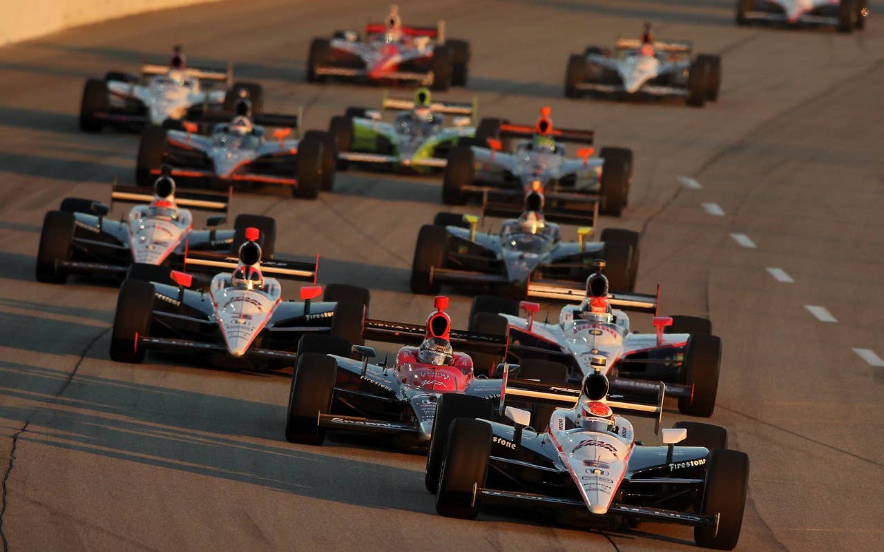 JOLIET, IL - AUGUST 28:  Ryan Briscoe of Australia in his #6 Team Penske Dallara Honda leads the field during  the Indy Car Series PEAK Antifreeze and Motor Oil Indy 300 on August 28, 2010 at Chicagoland Speedway in Joliet, Illinois.  (Photo by Jonathan Ferrey/Getty Images) *** Local Caption *** Ryan Briscoe