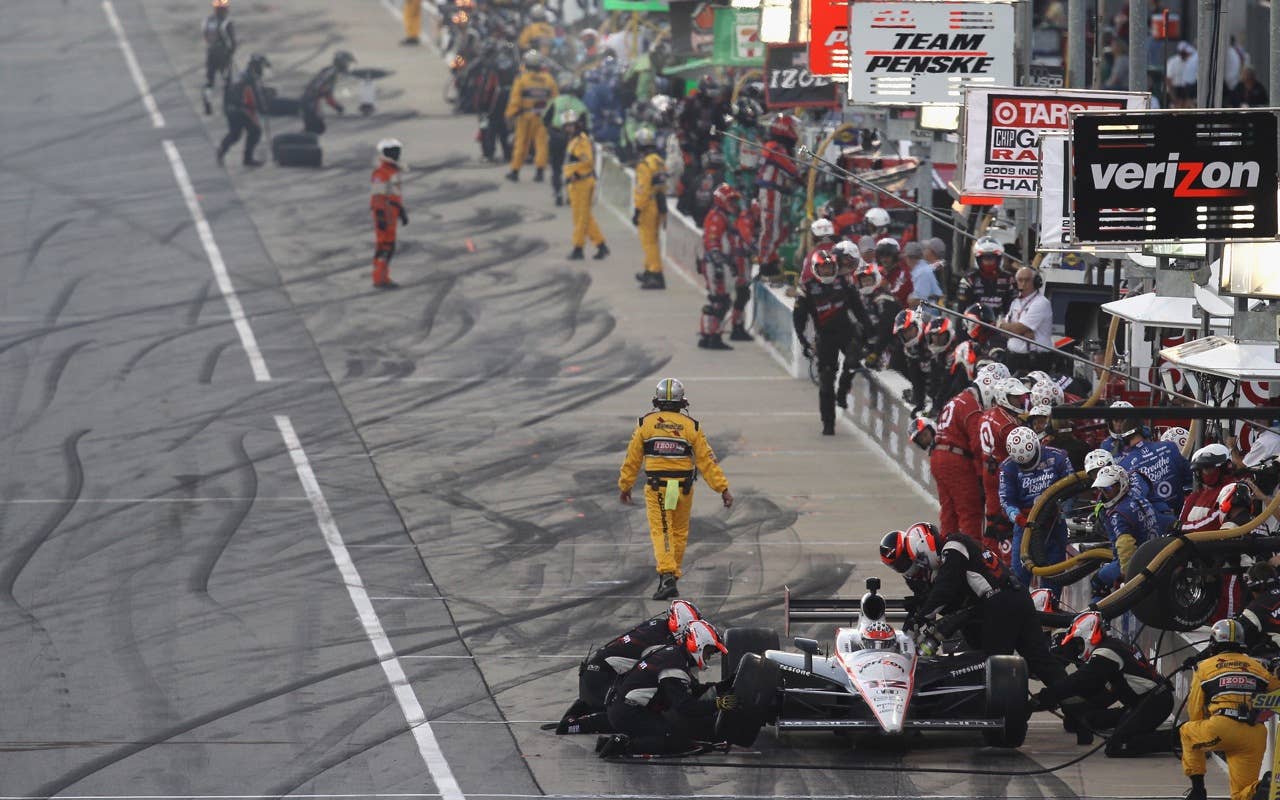 CHICAGO - AUGUST 28:  Will Power of Australia, driver of the #12 Verizon Team Penske Dallara Honda, makes a pit stop during the IndyCar Series PEAK Antifreeze and Motor Oil Indy 300 at Chicagoland Speedway on August 28, 2010 in Chicago, Illinois.  (Photo by Streeter Lecka/Getty Images) *** Local Caption *** Will Power