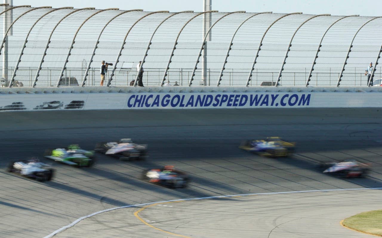Drivers make their way through a turn during practice for the Peak Antifreeze and Motor Oil Indy 300 auto race at Chicagoland Speedway in Joliet, Ill., Friday, Aug. 27, 2010, (AP Photo/Warren Wimmer)