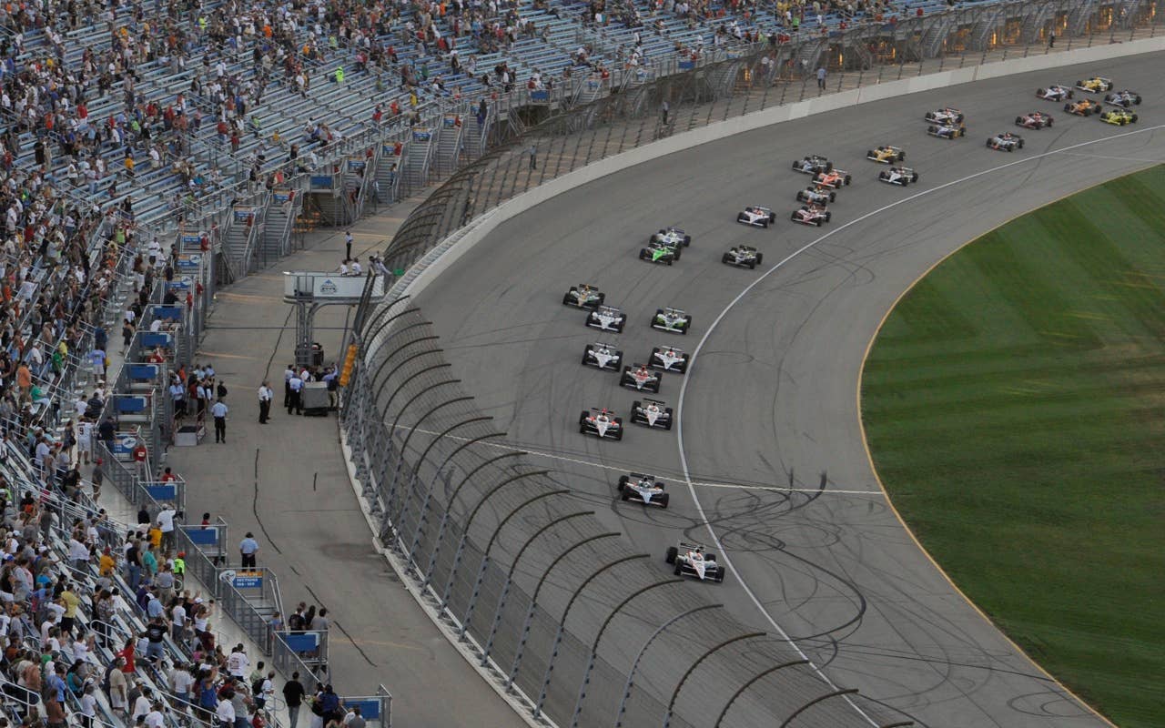 Pole sitter Ryan Briscoe, Sydney, Australia, leads the drivers at the start of the Peak Antifreeze and Motor Oil Indy 300 auto race in Joliet, Ill., Saturday, 28, 2010, (AP Photo/Warren Wimmer)