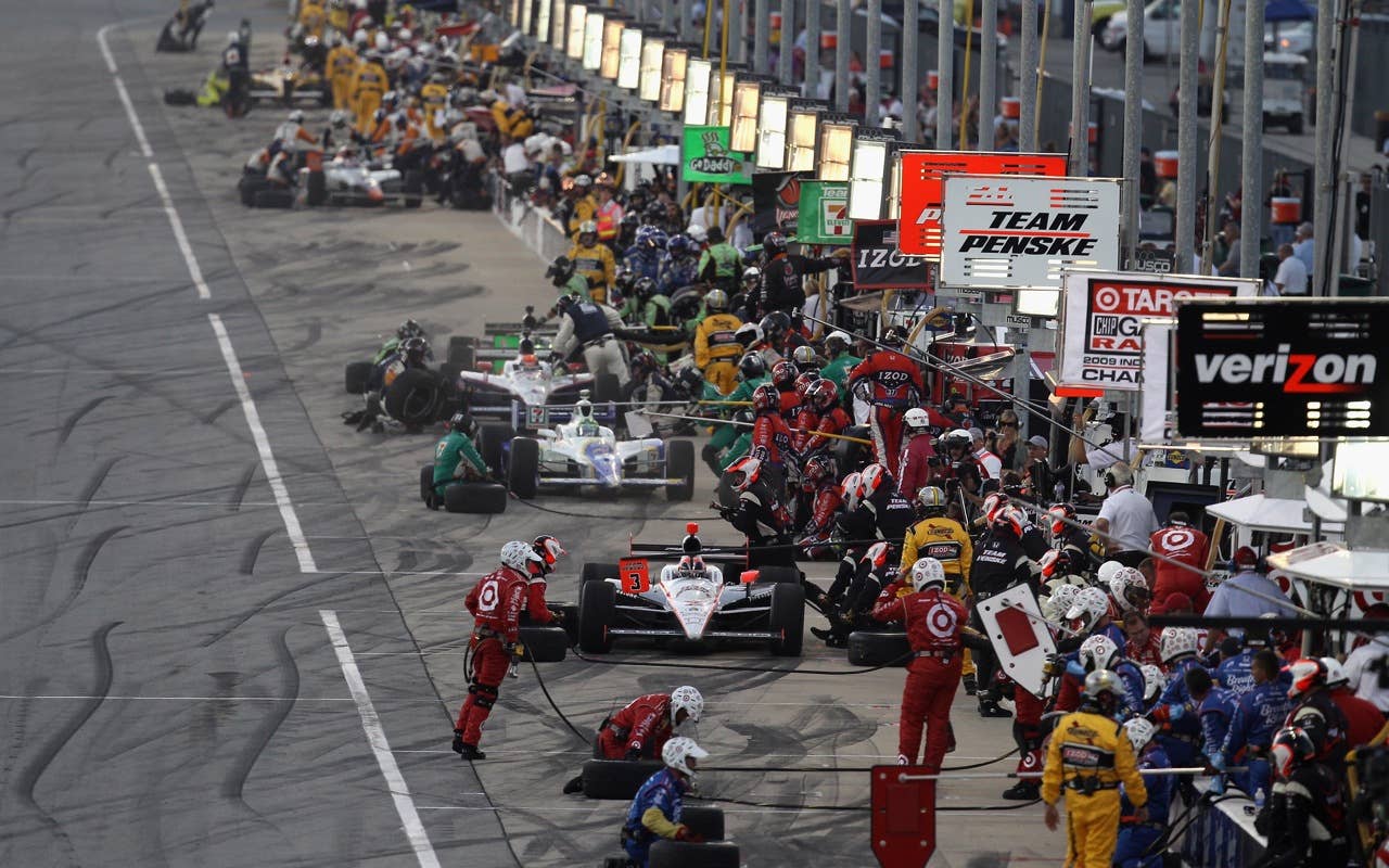 CHICAGO - AUGUST 28:  Helio Castroneves of Brazil, driver of the #3 Team Penske Dallara Honda, makes a pit stop during the IndyCar Series PEAK Antifreeze and Motor Oil Indy 300 at Chicagoland Speedway on August 28, 2010 in Chicago, Illinois.  (Photo by Streeter Lecka/Getty Images) *** Local Caption *** Helio Castroneves