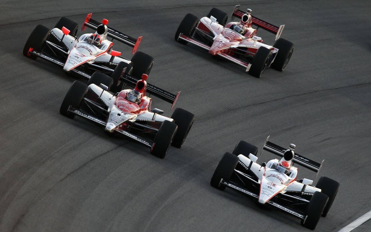 CHICAGO - AUGUST 28:  Ryan Briscoe, driver of the #6 Team Penske Dallara Honda, races Marco Andretti, driver of the #26 Team Venom Energy Andretti Autosport Dallara Honda, during the IndyCar Series PEAK Antifreeze and Motor Oil Indy 300 at Chicagoland Speedway on August 28, 2010 in Chicago, Illinois.  (Photo by Streeter Lecka/Getty Images) *** Local Caption *** Ryan Briscoe;Marco Andretti