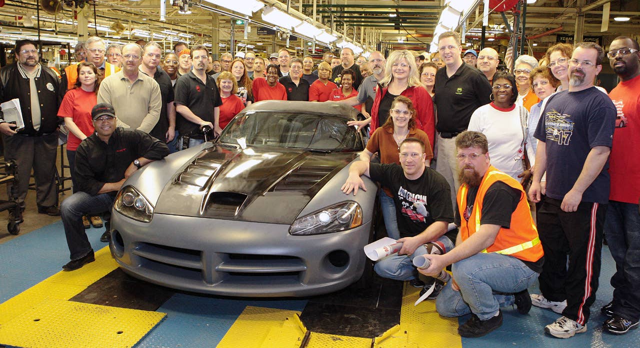 Detroit - March 29, 2010 - Dodge Brand President and Chief Executive Officer Ralph Gilles and Conner Avenue Assembly Plant employees celebrate the production launch of 25 spec-series 2010 Viper SRT10 ACR-X models as the car became the first of the 2010-model-year Dodge Vipers completed at the plant. Built for road-racing enthusiasts, the Dodge Viper ACR-X combines the best performance attributes of the record-setting, street-legal Dodge Viper ACR (American Club Racer) and the safety equipment of championship-winnning Viper Competition Coupes. "With its amazing on-track performance, the Viper ACR-X is going to seriously turn the heads of all road-racing enthusiasts, whether it is the grassroots driver all the way up to the professional," Gilles said.   Viper ACR-X is to debut in the Dodge Viper Cup spec-racing series in July. (Joe Wilssens photo)
