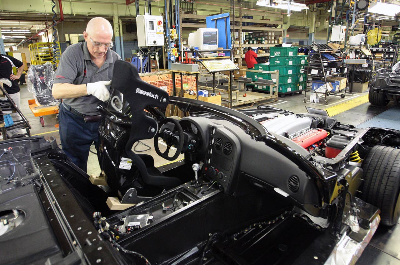 The non-street legal 2010 Dodge Viper ACR-X boasts safety features such as factory-designed race seat - shown here being installed at the Conner Avenue (Detroit) Assembly Plant. (Joe Wilssens photo)