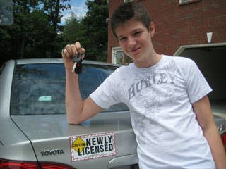 Kessler has developed signs for teens with learner permits and first-year licenses. They are attached magnetically to the car's sheet metal and display the words "Caution Newly Licensed." Here, Kessler's son Donnie poses next to the car he drives with the sign attached.Research More on Teen Driving SafetyMom Develops Safe "Teen Driving" SignCar SafetySafest Used Cars For Teens