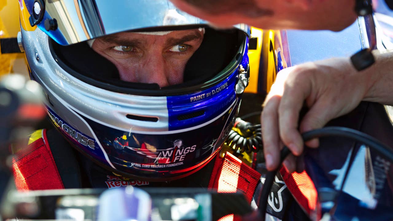 Tom Cruise drives the Red Bull F1 Race Car.