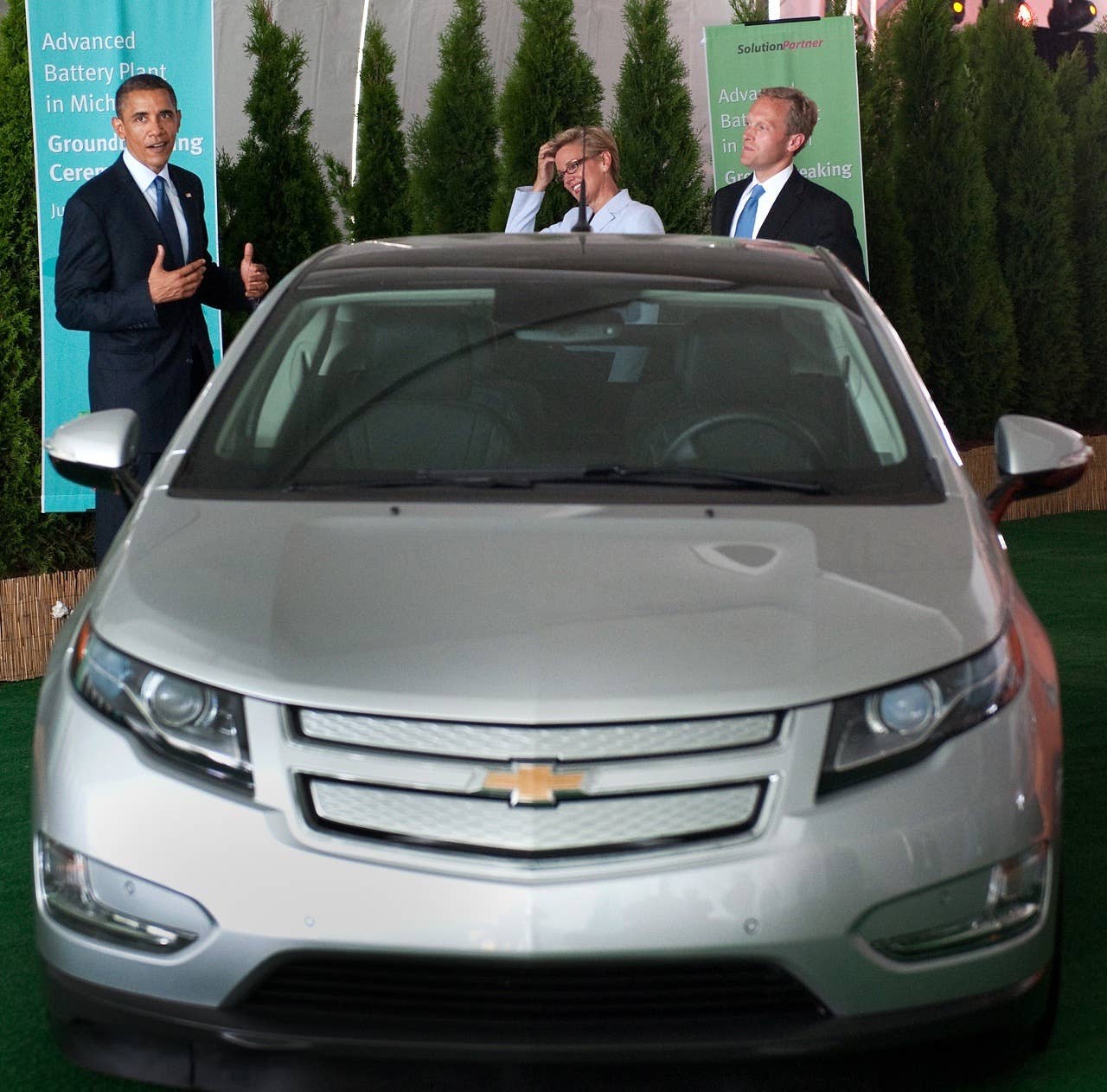 US President Barack Obama stands alongside an electric Chevrolet Volt and Holland, Michigan, Mayor Kurt Dykstra (C) and Michigan Governor Jennifer Granholm (R) following a groundbreaking ceremony for Compact Power's new advanced battery factory in Holland, Michigan, July 15, 2010. The plant will build batteries for electric vehicles including the Chevrolet Volt and Ford Focus. AFP PHOTO / Saul LOEB (Photo credit should read SAUL LOEB/AFP/Getty Images) *** THIRD PARTY Editorial Rights Have Been Purchased by Chevrolet for Editorial Use by print and online media.