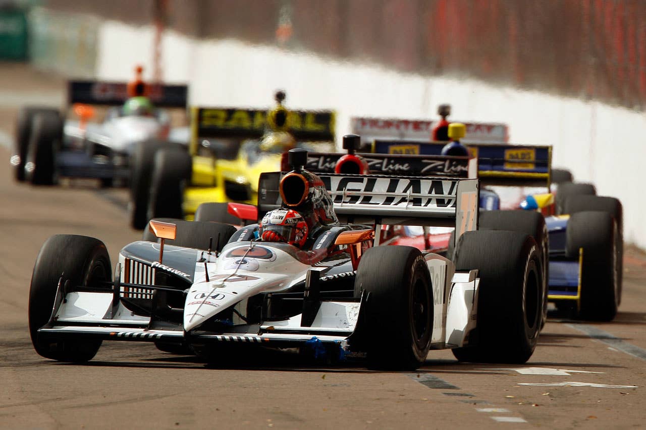 ST PETERSBURG, FL - MARCH 29:  Alex Tagliani of Canada, driver of the #77 FAZZT Race Team Dallara Honda leads a pack of cars during the IndyCar Series Honda Grand Prix of St. Petersburg on March 29, 2010 on the streets of St. Petersburg, Florida.  (Photo by Chris Graythen/Getty Images) *** Local Caption *** Alex Tagliani