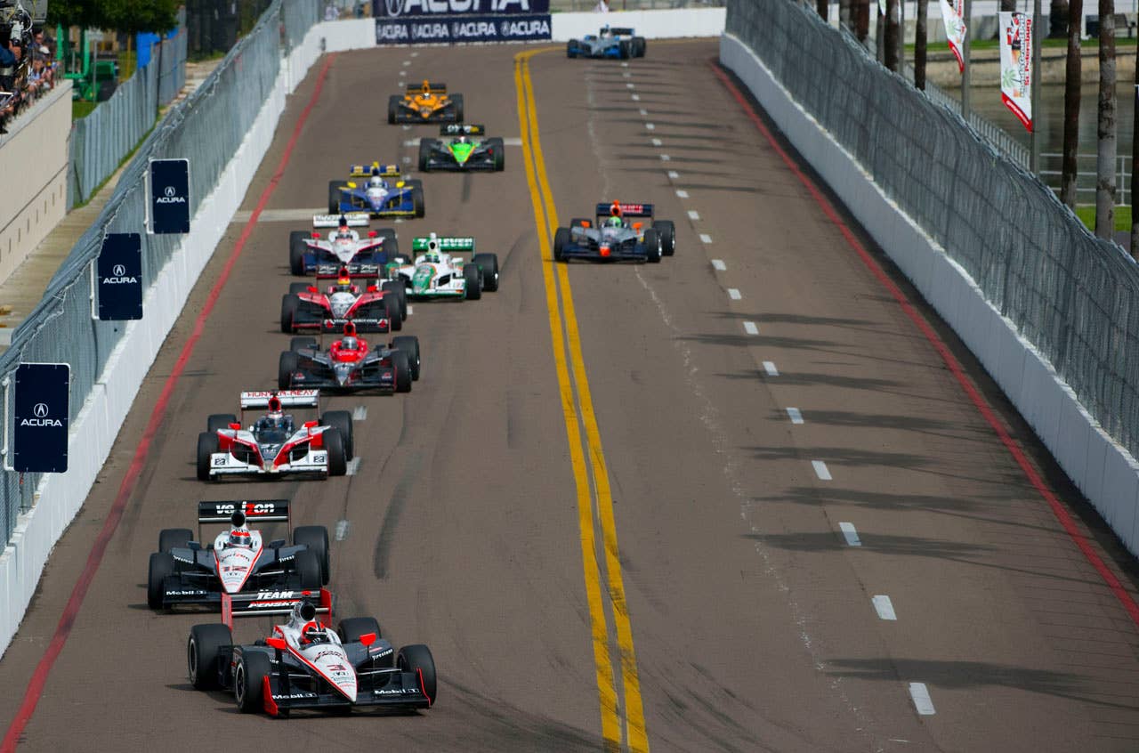 ST. PETERSBURG, FL - MARCH 29:  Helio Castroneves driver of the #3 Team Penske Dallara Honda leads a pack of cars during the IndyCar Series Honda Grand Prix of St.Petersburg on March 29, 2010 on the streets of St. Petersburg, Florida. (Photo by Robert Laberge/Getty Images) *** Local Caption *** Helio Castroneves