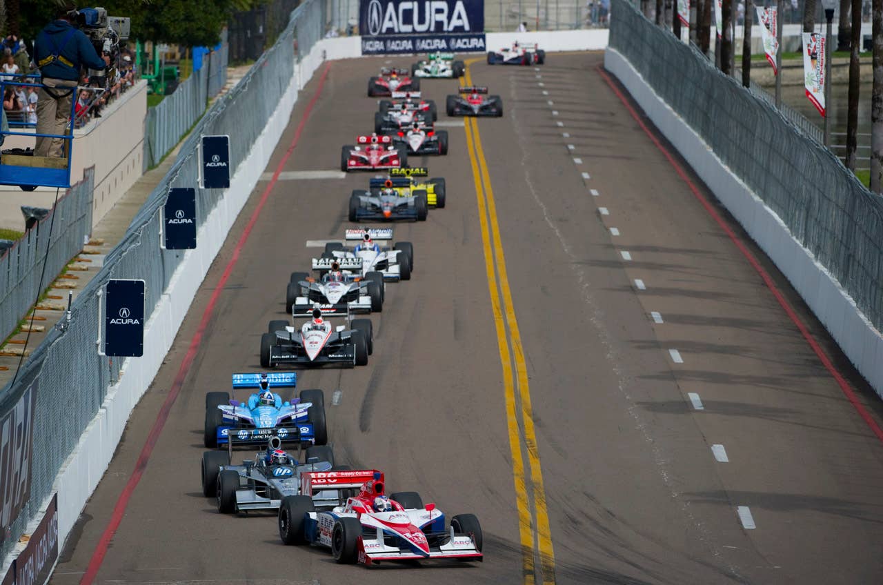ST. PETERSBURG, FL - MARCH 29:  Vitor Meira of Brazil driver of the #14 A. J. Foyt Enterprises Dallara Honda leads a pack of cars during the IndyCar Series Honda Grand Prix of St.Petersburg on March 29, 2010 on the streets of St. Petersburg, Florida. (Photo by Robert Laberge/Getty Images) *** Local Caption *** Vitor Meira