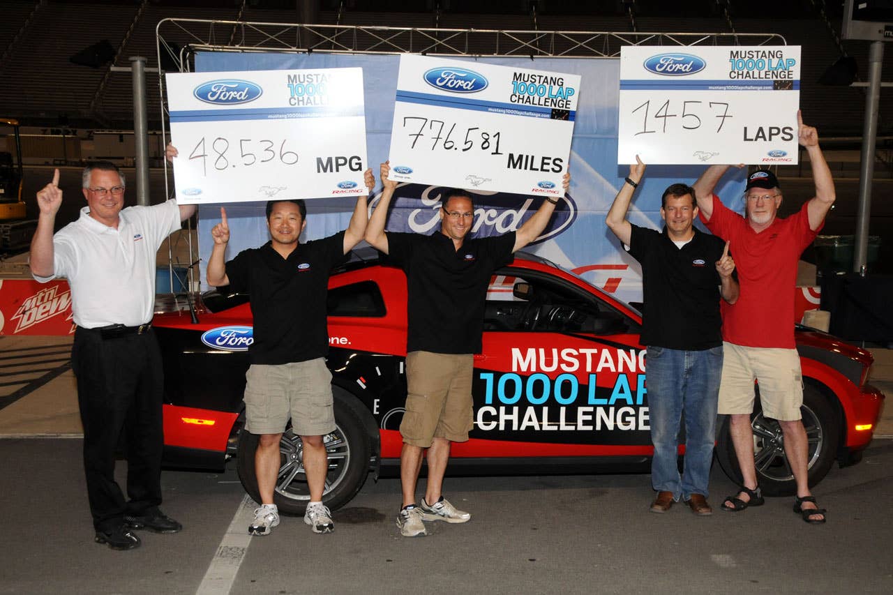 06/23/10 Bristol, Tn. -  Members of the Mustang 1000 Lap Challenge driving team celebrate after completing the 1000 Lap Challenge at Bristol Motor Speedway early Thursday morning. The 2011 Mustang V6 logged 1,457 laps for 776.581 miles and an average of 48.536 mpg after running for nearly 18 hours. l-r Tim Duerr - Ford Racing, Seong Park - Mustang engineer,  Jonathan Mehl - Mustang engineer, Tom Barnes - Mustang engineer, Carl Ek - Mustang engineer.  2010, Paul Webb