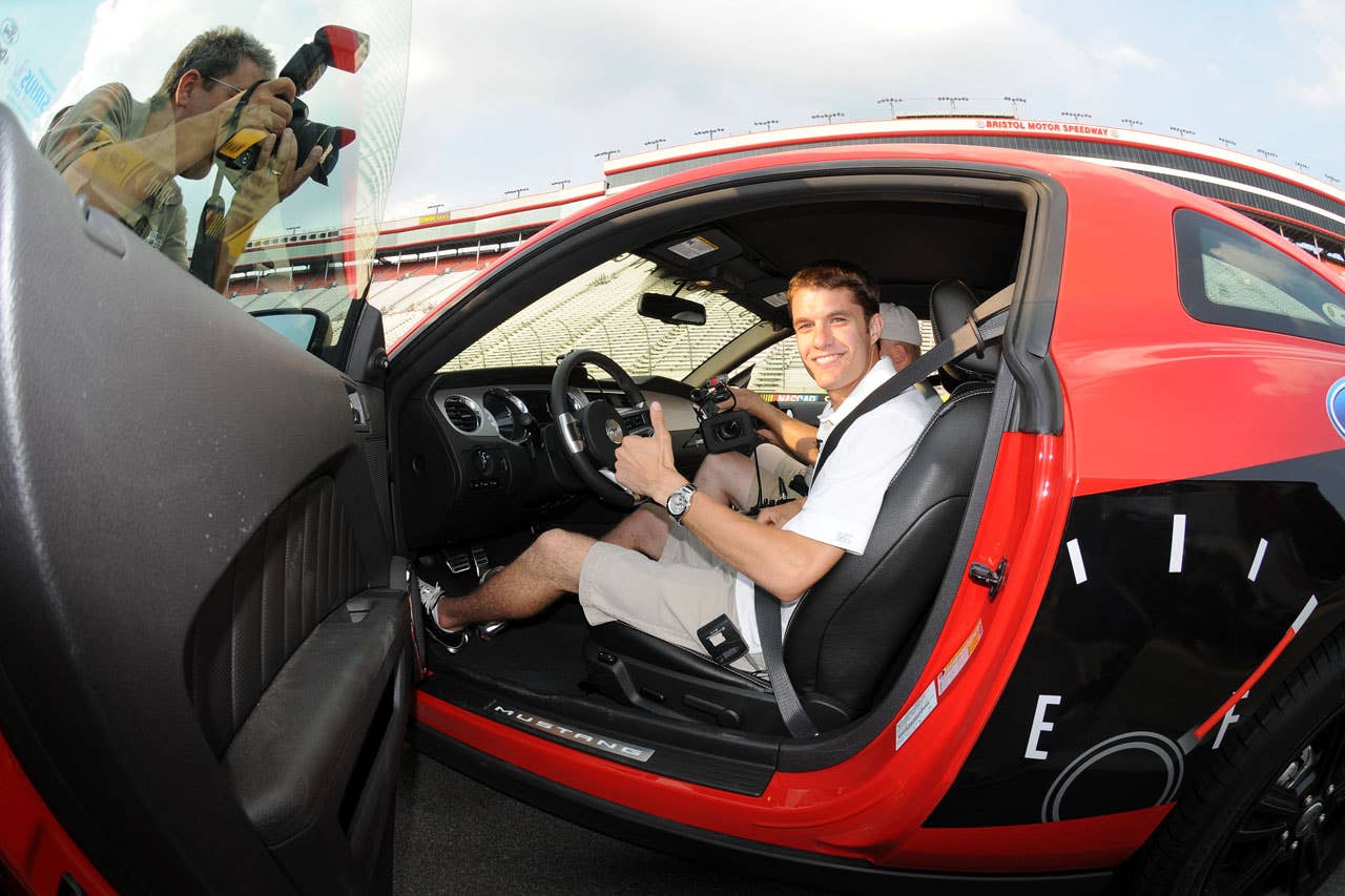 06/23/10 Bristol, Tn. - Ford NASCAR driver David Ragan gives a thumbs up as he climbs into the 2011 Mustang V6 as he prepares to surpass the 1000 lap mark on a single tank of fuel in the Mustang 1000 Lap Challenge at Bristol Motor Speedway.     2010, Paul Webb