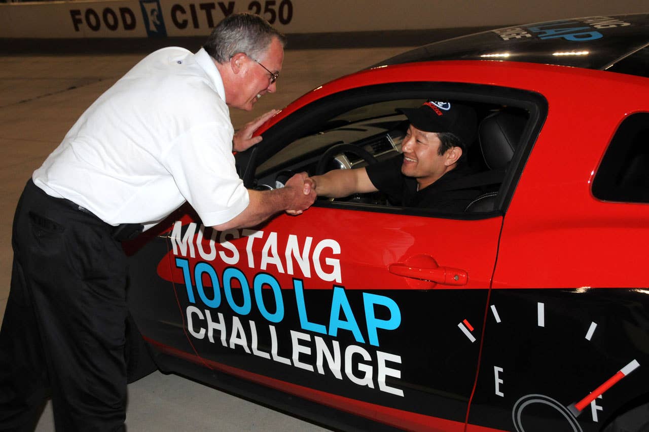 06/23/10 Bristol, Tn. - Mustang engineer Seong Park is congratulated by Tim Duerr of Ford Racing after the 2011 Mustang V6 finally coasted to a stop on the backstretch of Bristol Motor Speedway after completeing 1,457 laps and averaging better than 48 MPG over the distance of the Mustang 1000 Lap Challenge.    2010, Paul Webb
