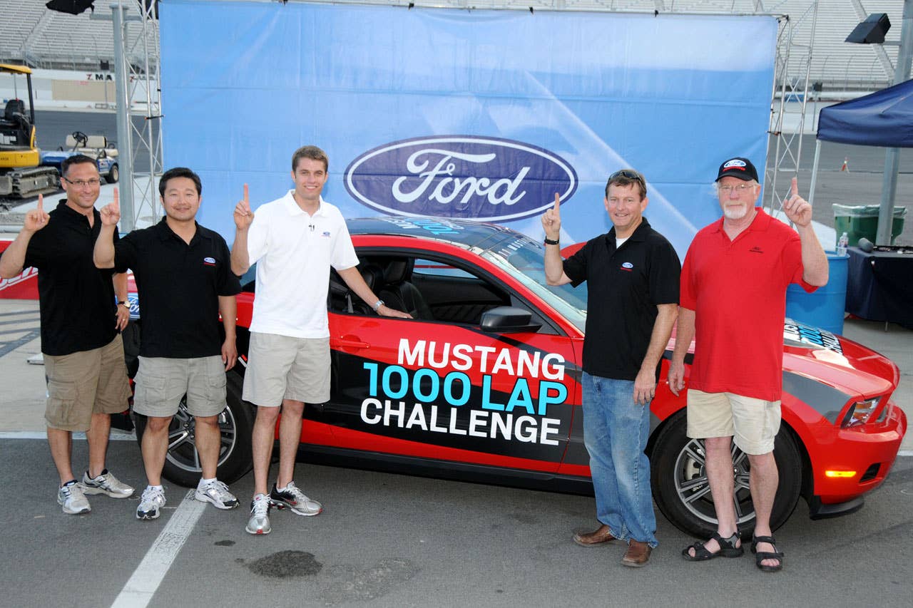 06/23/10 Bristol, Tn. -  Celebrating lap one thousand of the Mustang 1000 Lap Challenge with the Mustang V6 are (l -r), Mustang engineers Jonathan Mehl and Seong Park, Ford NASCAR driver David Ragan, and Mustang engineers Tom Barnes and Carl Ek.  2010, Paul Webb
