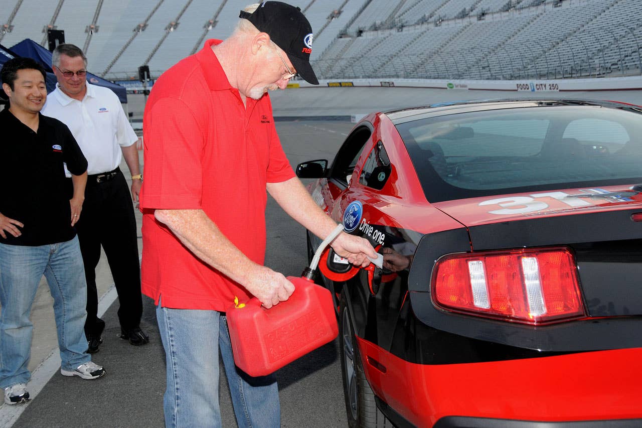 06/23/10 Bristol, Tn.  Ford Mustang engineer Carl Ek packs as much fuel as possible into the stock 2011 Ford Mustang V6 prior to the Mustang 1000 Lap Challenge at Bristol Motor Speedway.  2010, Paul Webb