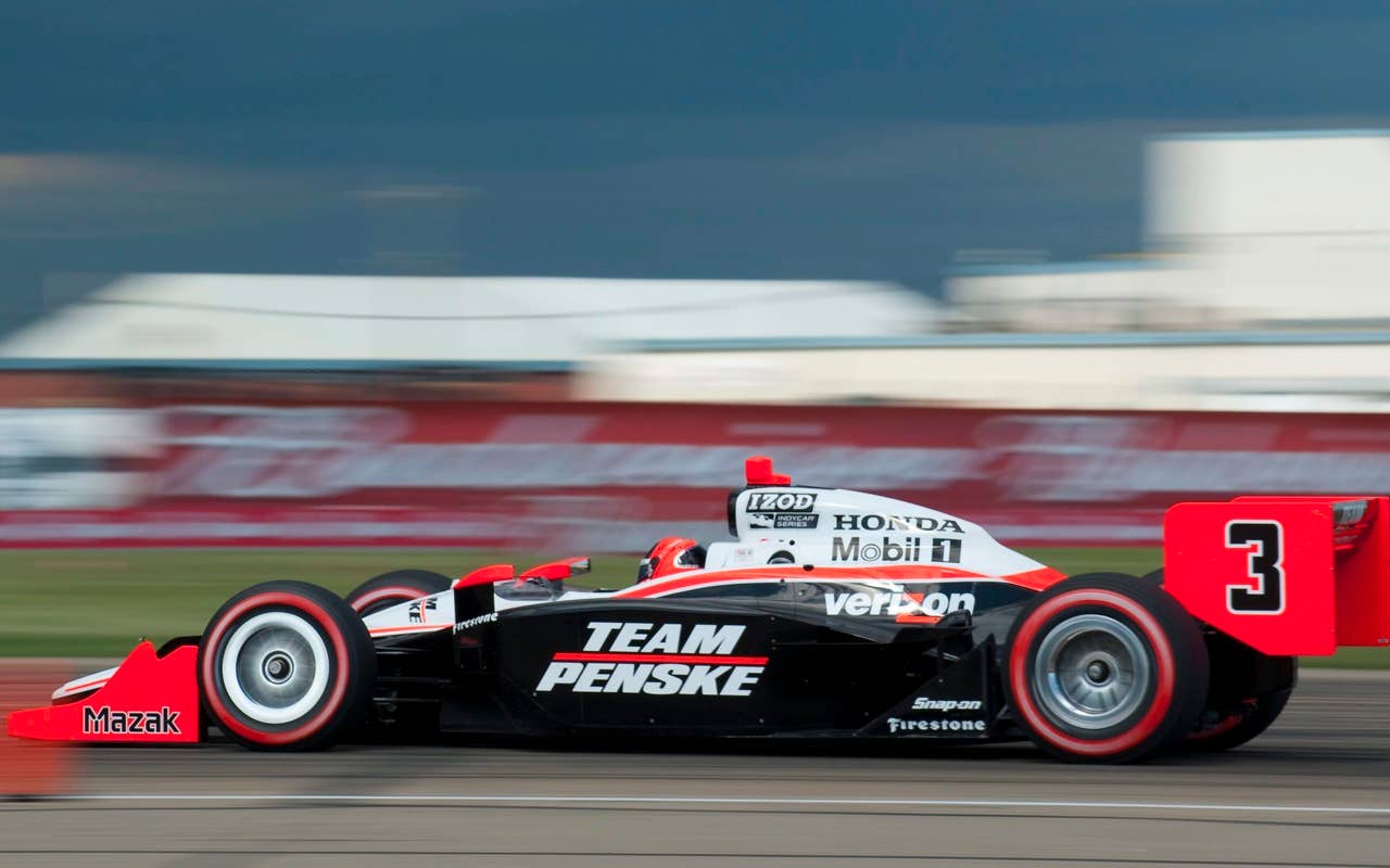 Brazil's Helio Castroneves races during qualifying for the IRL Honda Indy Edmonton auto race, in Edmonton, Alberta, on Saturday, July 24, 2010. (AP Photo/The Canadian Press, John Ulan)