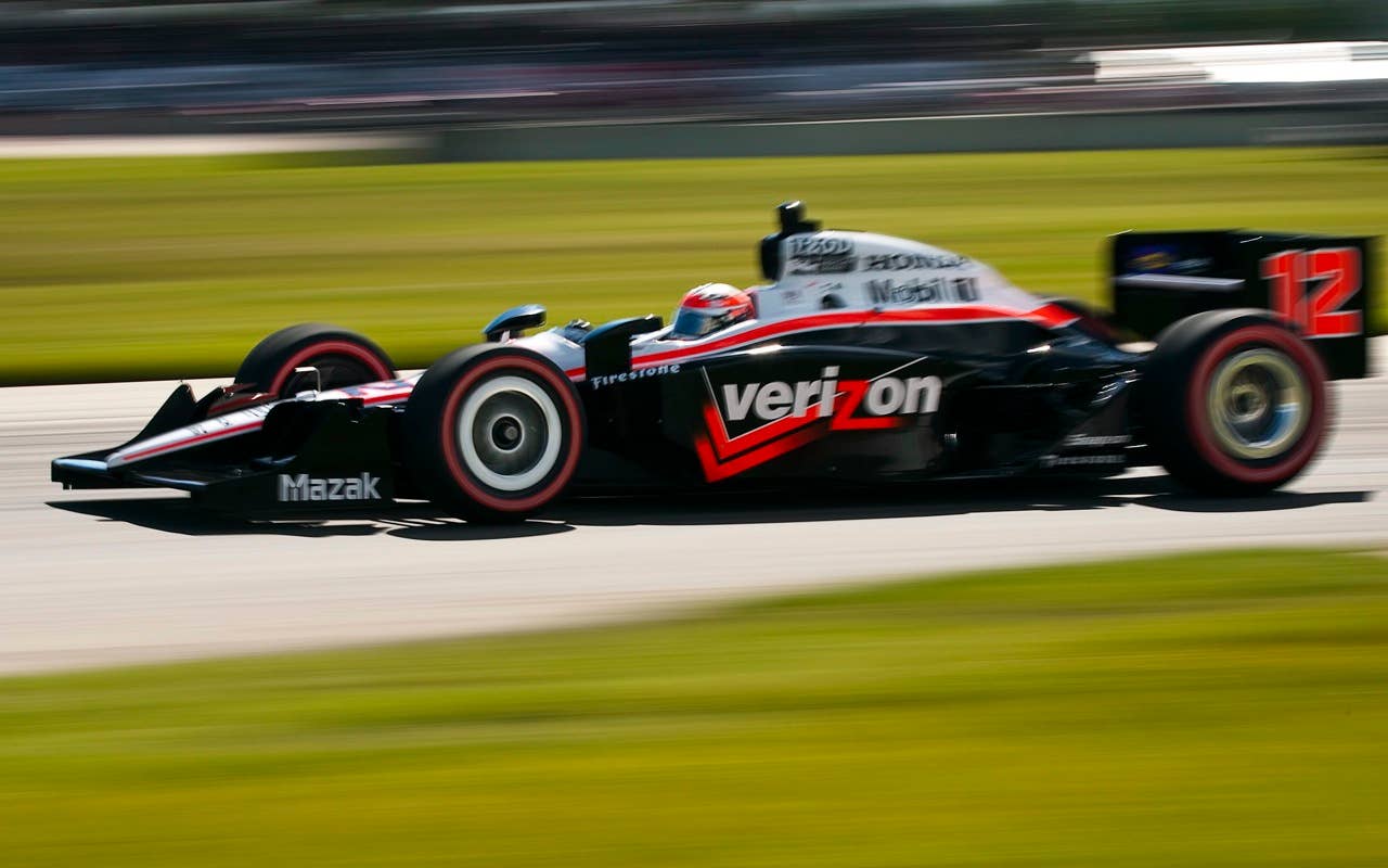 Australia's Will Power races during qualifying at the Honda Indy Edmonton auto race, in Edmonton, Alta., Saturday, July 24, 2010. Power won the pole position for Sunday's race. (AP Photo/The Canadian Press, Jeff McIntosh)