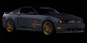Powered by imagination, this Ford Mustang showcases Ford Custom Accessories. The metallic gold design cues are inspired by such premier fashion designers as Prada, Stella McCartney and Balenciaga. The vehicle features unique Carbon Black Metallic exterior custom paint that is accented by gold 20-inch wheels and gold-tinted headlights and fog lamps. Inside, the gold theme continues with leather seat and door trim inserts, steering wheel cover and shifter boot.