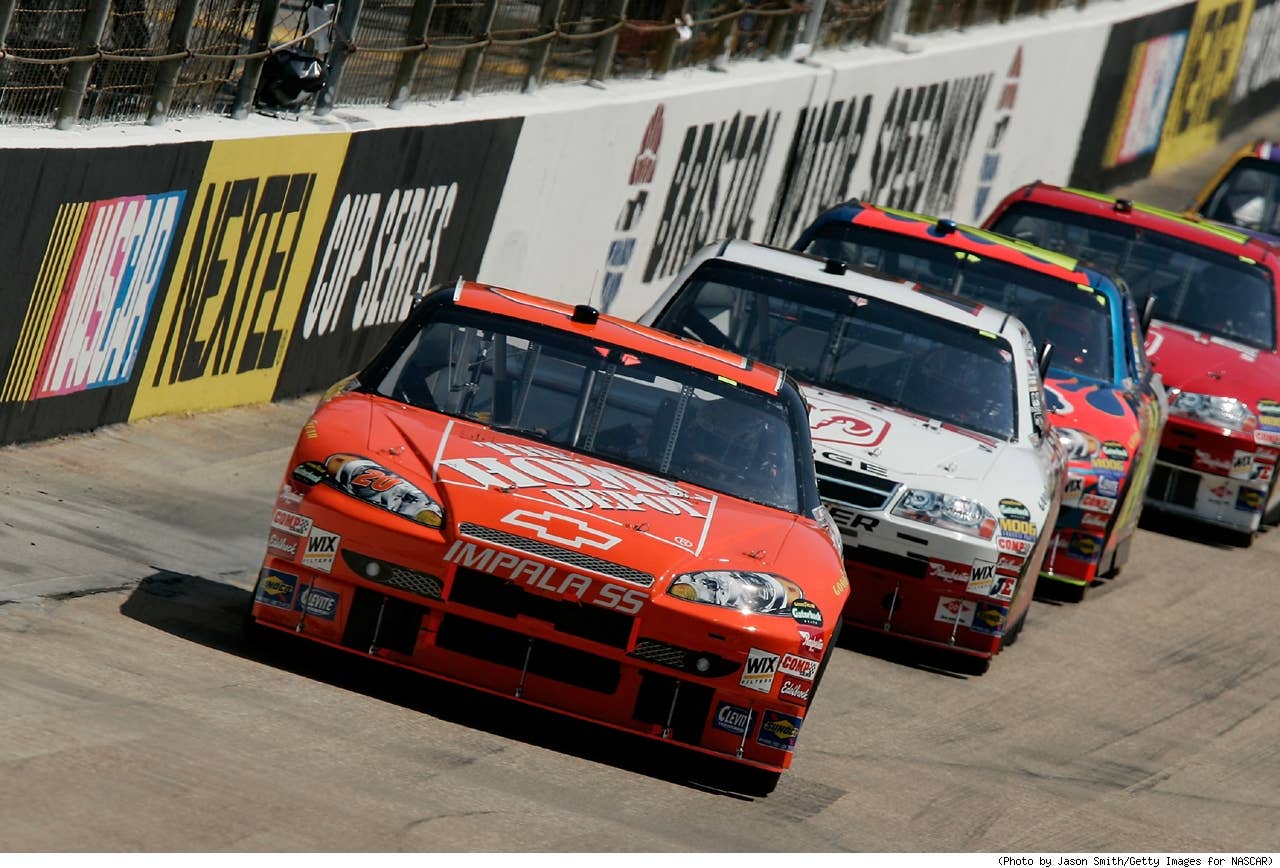 Tony Stewart, driver of the #20 The Home Depot Chevrolet, leads Kasey Kahne, driver of the #9 Dodge Dealers/UAW Dodge, and others during the NASCAR Nextel Cup Series Food City 500 at Bristol Motor Speedway on March 25, 2007 in Bristol, Tennessee.