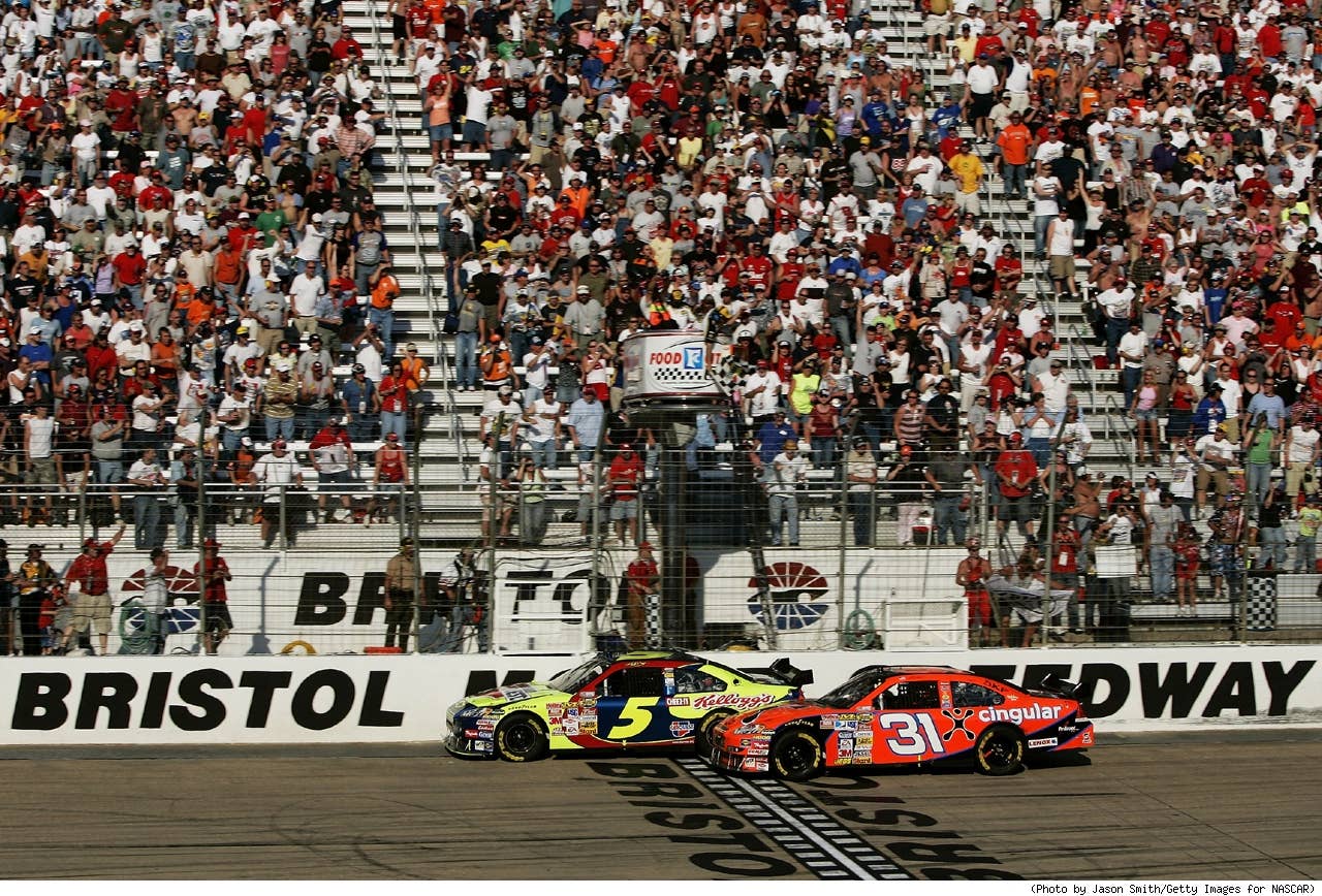 Kyle Busch, driver of the #5 Carquest/Kellogg's Chevrolet, crosses the finish line ahead of Jeff Burton, driver of the #31 Cingular Chevrolet, to win the NASCAR Nextel Cup Series Food City 500 at Bristol Motor Speedway on March 25, 2007 in Bristol, Tennessee. Busch became the first to win a race in the new Car of Tomorrow which was developed to be safer than previous models of vehicles used in stock car racing.
