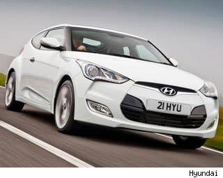 MSRP: $17,450 - $21,950 Invoice: $16,842 - $20,898 Fuel Economy: 28 mpg City, 40 mpg Highway  The Hyundai Veloster is a car that is growing on us. As in the case of the MINI Cooper, we prefer the turbo-charged version.  When the Veloster was first introduced to us on the auto show circuit, some thought it was odd duck with its one rear door, and an answer to a question no one was asking. But the solid reception of the car by the media and the public shows that clever and expressive styling is always welcome.  All that combined with Hyundai's warranty and quality ratings makes it a leading choice in the hatchback arena for us.  Research the Hyundai Veloster Hyundai Veloster Photos & Information Hyundai Veloster Specs Hyundai Veloster Local Dealer Price Quote