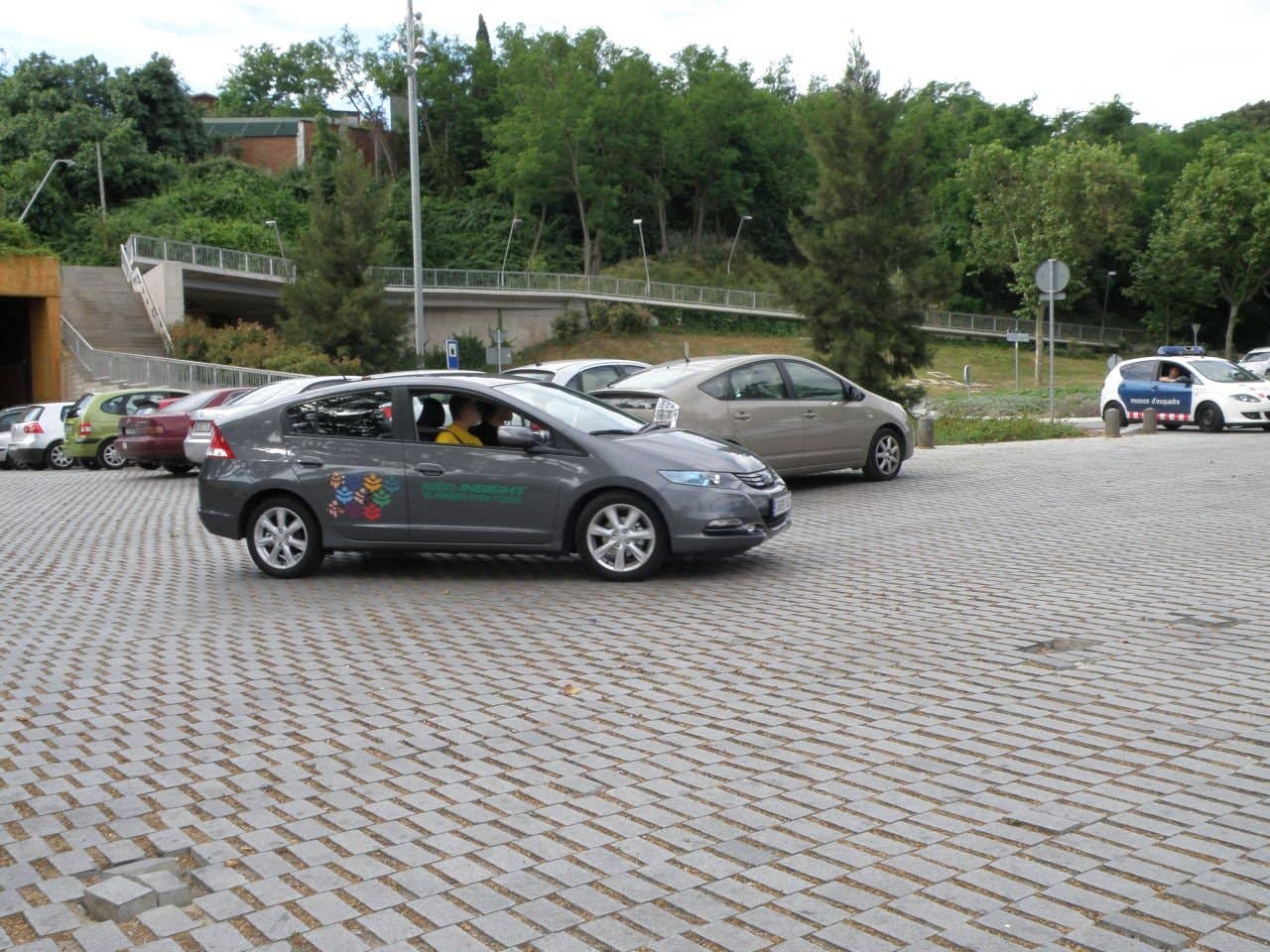 Cars leaving the hotel court to start their hypermiling test