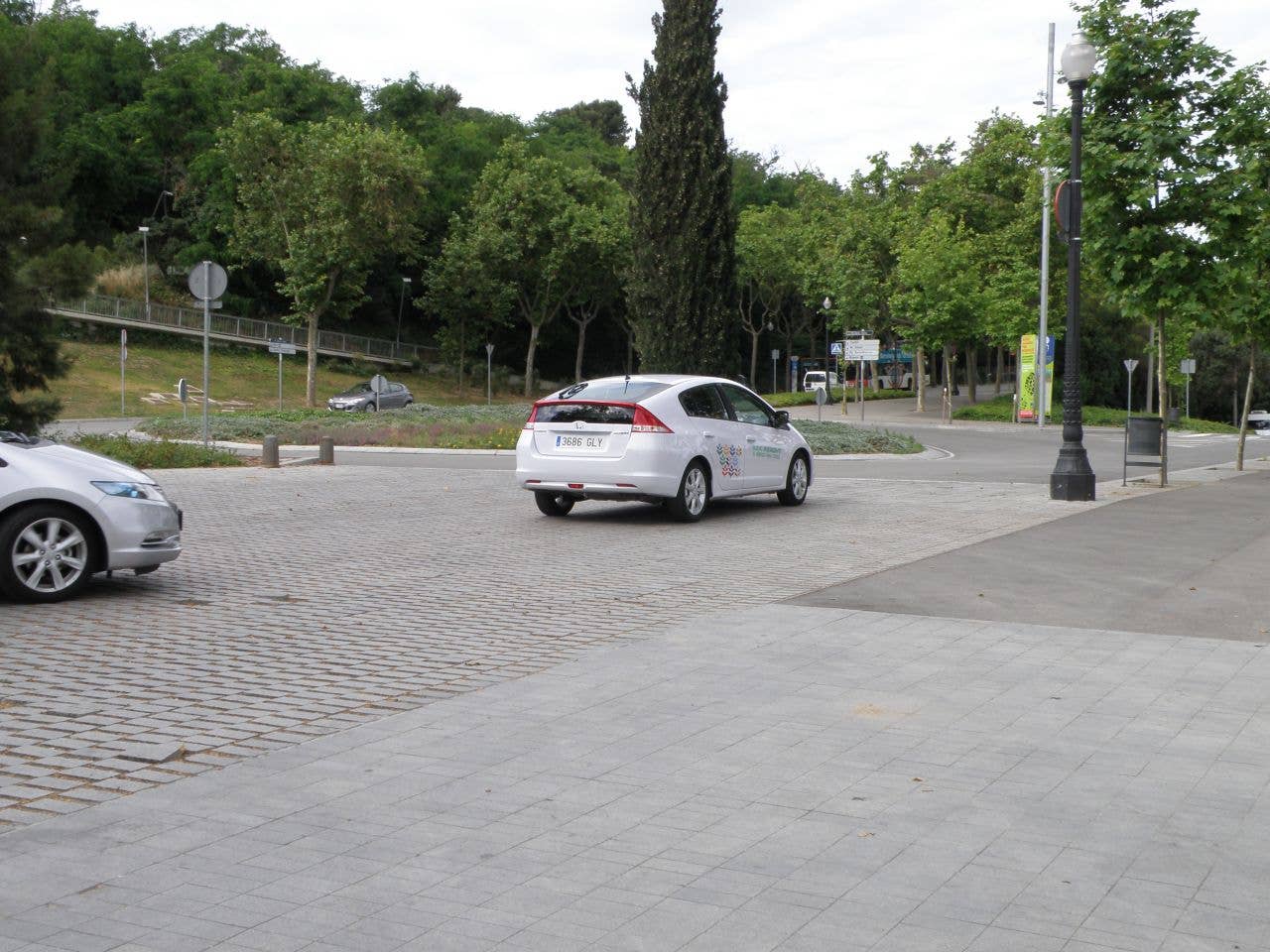 Cars leaving the Hotel Miramar court to perform the hypermiling test