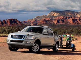 MSRP: $27,810 - $35,190 Invoice: $25,937 - $32,653 Fuel Economy: 20 mpg Hwy, 14 mpg City The Ford Explorer Sport Trac is effectively an Explorer SUV with a pickup bed, a midsize utility vehicle that delivers rugged styling, capable power and a versatile cargo area.Research the Ford Explorer Sport TracFord Explorer Sport Trac OverviewFord Explorer Sport Trac PhotosFree Ford Explorer Sport Trac Price Quote
