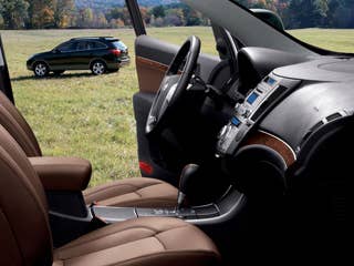 MSRP: $27,145 - $35,995 Invoice: $25,766 - $33,366 Fuel Economy: 23 mpg Hwy, 16 mpg City The Hyundai Veracruz has instruments that are illuminated with a crisp blue backlighting, cupholders that are ringed with glowing blue light, and cubbies that are lined with a soft, velvety material. All Veracruz models will seat seven, with a third row that tumbles flat into the floor.Research the Hyundai VeracruzHyundai Veracruz OverviewHyundai Veracruz PhotosFree Hyundai Veracruz Price Quote