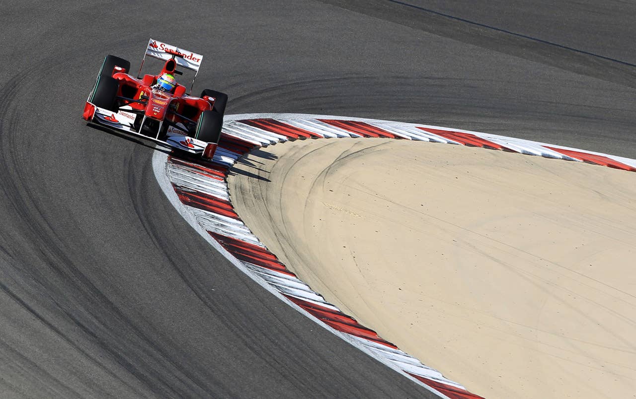 Ferrari's Brazilian driver Felipe Massa drives at the Bahrain international circuit on March 14, 2010 in Manama, during the Bahrain Formula One Grand Prix.        AFP PHOTO / KHALED DESOUKI (Photo credit should read KHALED DESOUKI/AFP/Getty Images)