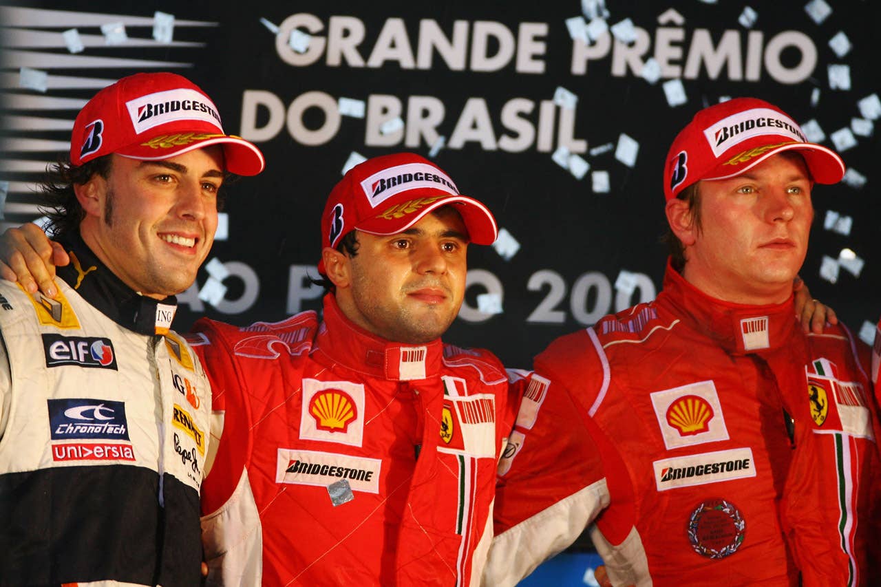 SAO PAULO, BRAZIL - NOVEMBER 02: Felipe Massa (C) of Brazil and Ferrari looks disappointed on the podium alongside second placed Fernando Alonso (L) of Spain and Renault and third placed Kimi Raikkonen (R) of Finland and Ferrari after winning the race but losing the World Championship at the Brazilian Formula One Grand Prix at the Interlagos Circuit on November 2, 2008 in Sao Paulo, Brazil. (Photo by Getty Images)