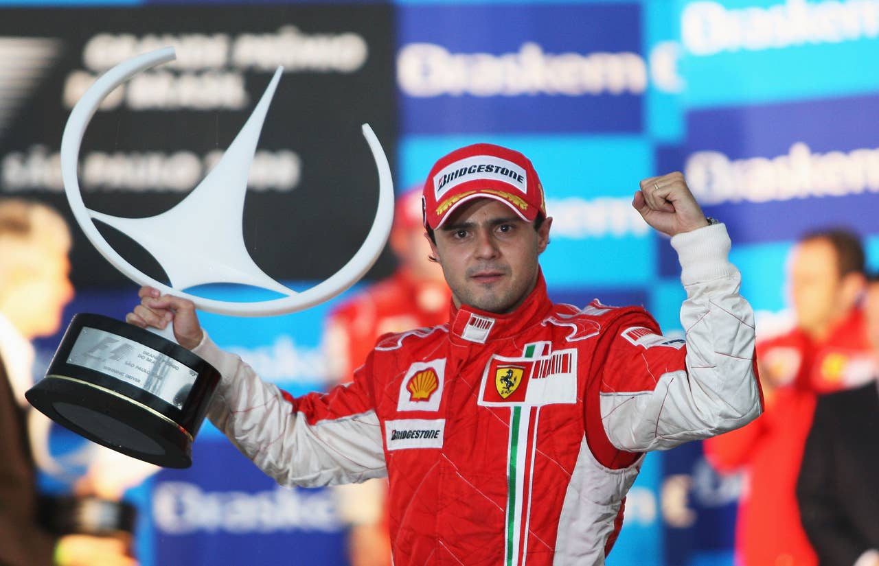 SAO PAULO, BRAZIL - NOVEMBER 02: Felipe Massa of Brazil and Ferrari looks disappointed on the podium after winning the race but losing the World Championship at the Brazilian Formula One Grand Prix at the Interlagos Circuit on November 2, 2008 in Sao Paulo, Brazil. (Photo by Mark Thompson/Getty Images)