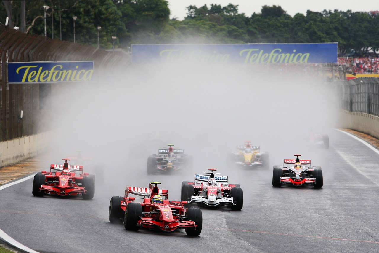 SAO PAULO, BRAZIL - NOVEMBER 02: Felipe Massa (C) of Brazil and Ferrari leads from Kimi Raikkonen (L) of Finland and Ferrari, Jarno Trulli (2nd right) of Italy and Toyota and Lewis Hamilton (R) of Great Britain and McLaren Mercedes at the start of the Brazilian Formula One Grand Prix at the Interlagos Circuit on November 2, 2008 in Sao Paulo, Brazil. (Photo by Mark Thompson/Getty Images)