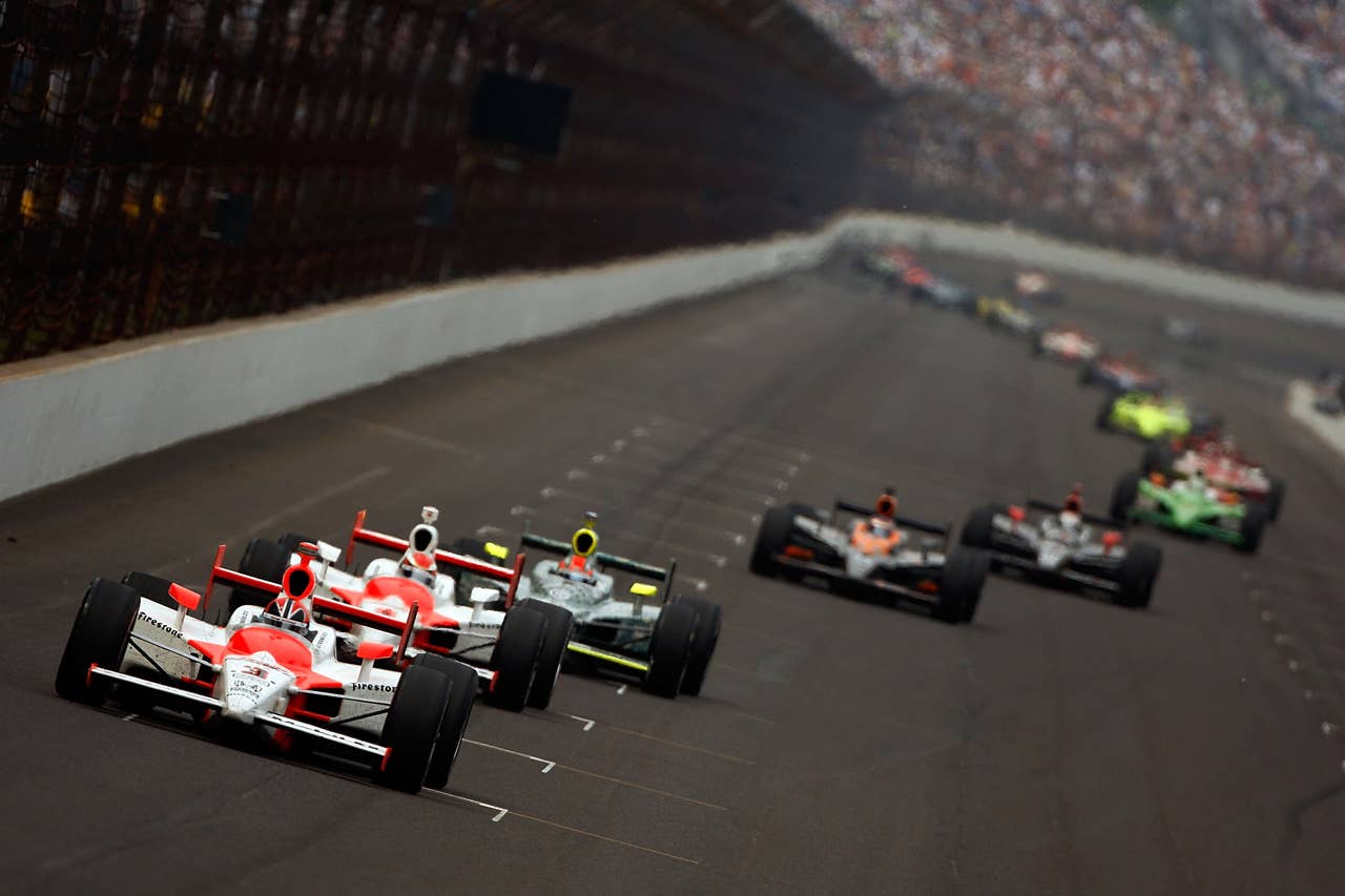 INDIANAPOLIS - MAY 24: Helio Castroneves, driver of the #3 Team Penske Dallara Honda, leads a line of cars during the IRL IndyCar Series 93rd running of the Indianapolis 500 on May 24, 2009 at the Indianapolis Motor Speedway in Indianapolis, Indiana. (Photo by Chris Graythen/Getty Images)