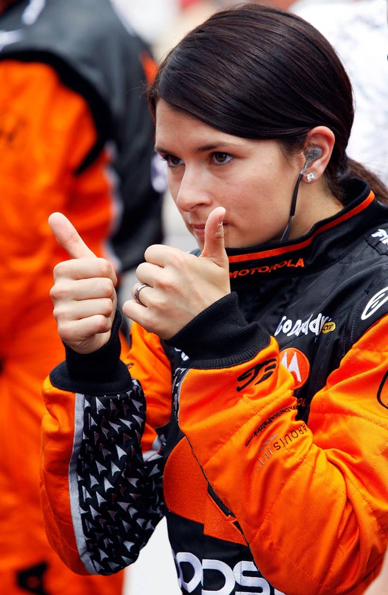 INDIANAPOLIS - MAY 24: Danica Patrick, driver of the #7 Boost Mobile/Motorola Andretti Green Racing Dallara Honda, prepares to enter her car prior to the start of the IRL IndyCar Series 93rd running of the Indianapolis 500 on May 24, 2009 at the Indianapolis Motor Speedway in Indianapolis, Indiana. (Photo by Jamie Squire/Getty Images)