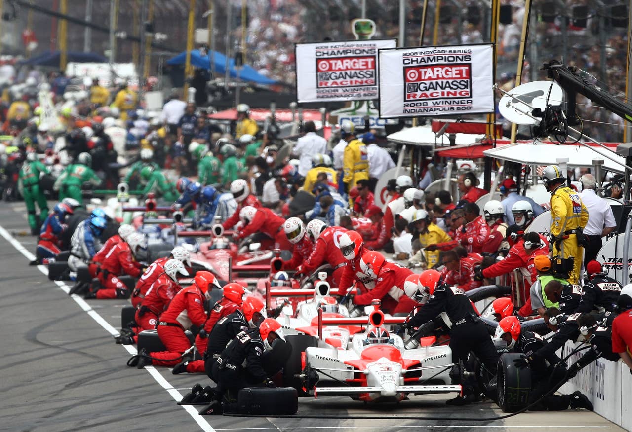 INDIANAPOLIS - MAY 24: Helio Castroneves, driver of the #3 Team Penske Dallara Honda, makes a pit stop during the IRL IndyCar Series 93rd running of the Indianapolis 500 on May 24, 2009 at the Indianapolis Motor Speedway in Indianapolis, Indiana. (Photo by Donald Miralle/Getty Images)