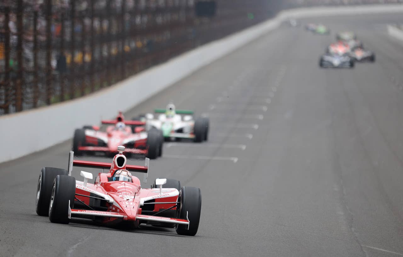 INDIANAPOLIS - MAY 24: Scott Dixon driver of the #9 Target Chip Ganassi Dallara Honda leads his teamate Dario Franchitti and the rest of the field during the IRL IndyCar Series 93rd running of the Indianapolis 500 at the Indianapolis Motor Speedway on May 24, 2009 in Indianapolis, Indiana. (Photo by Robert Laberge/Getty Images)