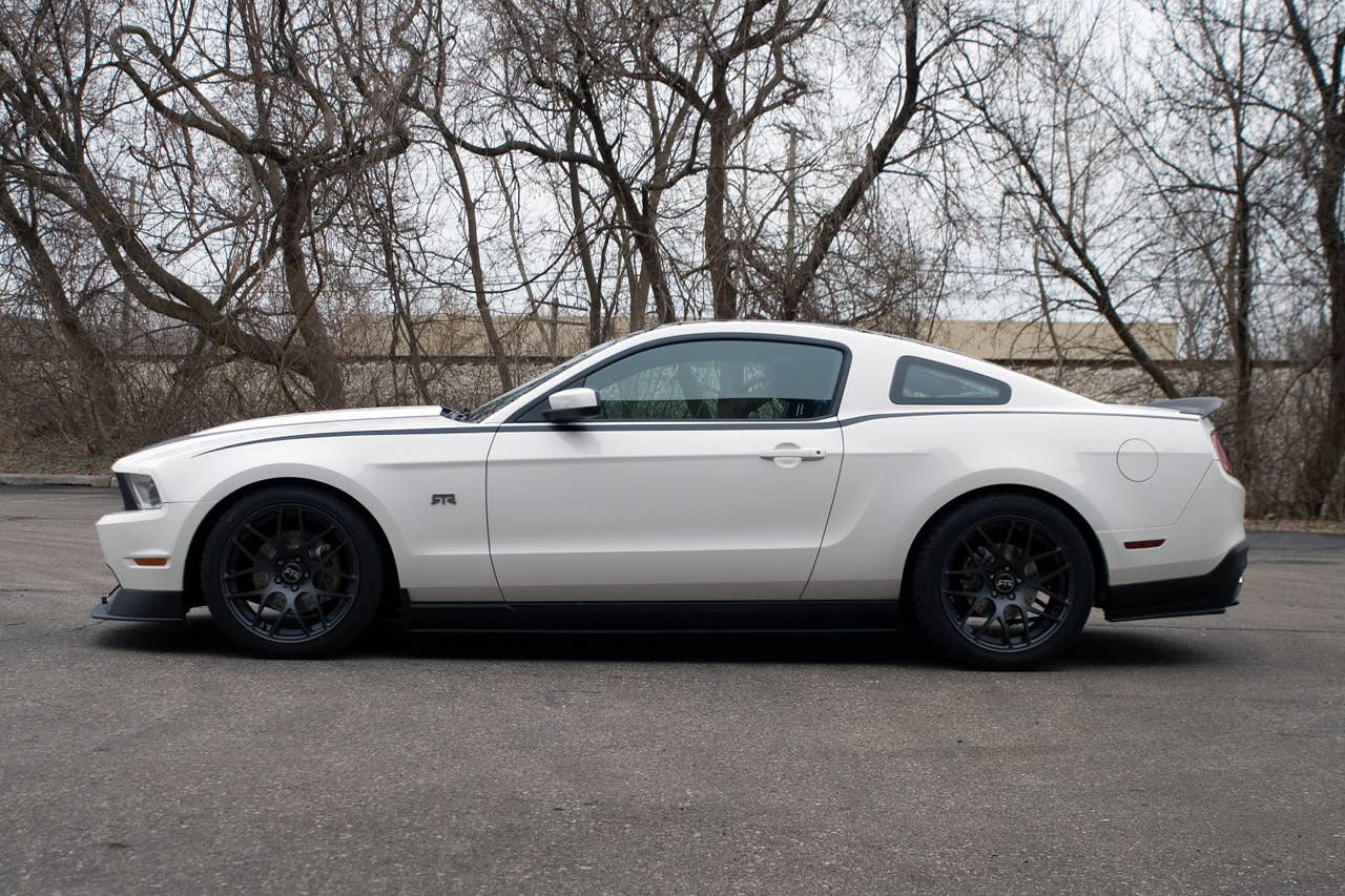 2011 Mustang RTR package: Mustang RTR, a new dealer-installed package for the 2011 Ford Mustang, delivers performance and appearance upgrades for spirited driving. The package was introduced by Vaughn Gittin Jr., driver of the Monster Energy/Falken Tire 2011 Mustang GT in the Formula Drift series. (06/11/2010)