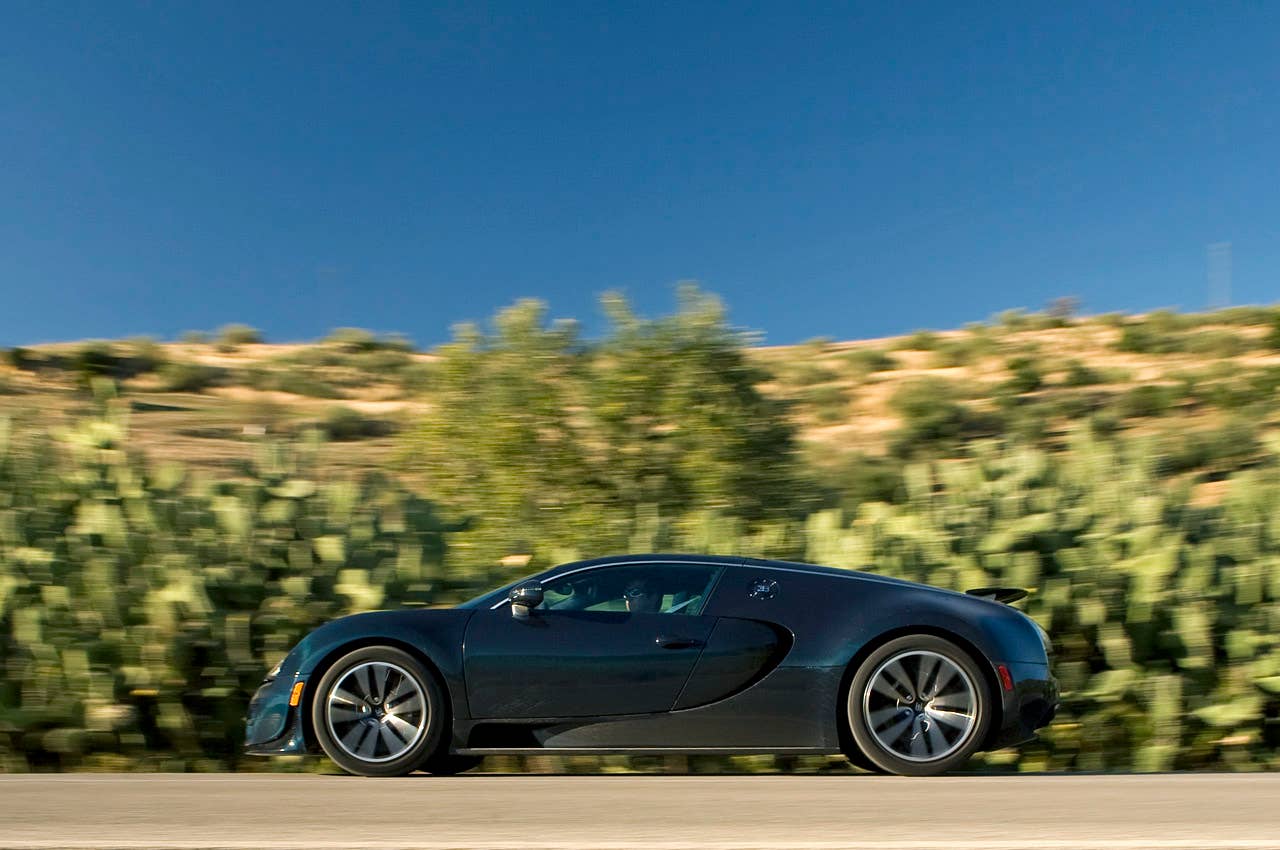 2011 Bugatti Veyron Super Sport side driving view