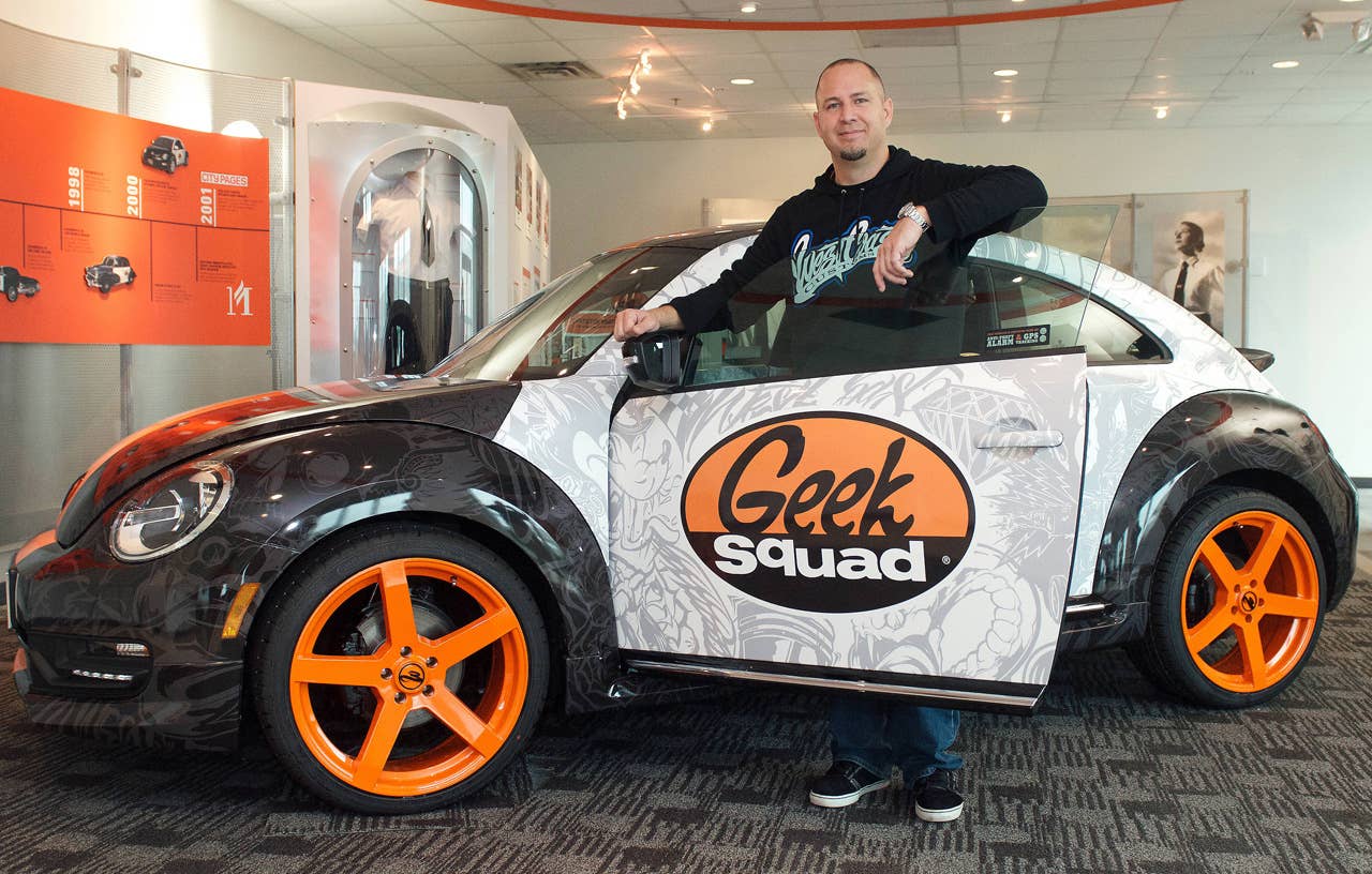 Scott Voinovich, of West Coast Customs, delivered a "tricked-out" Geekmobile to Geek Squad City Friday, Dec. 7, 2012 in Louisville, Ky. (Photo by Joe Imel/Invision for Best Buy/AP Images)