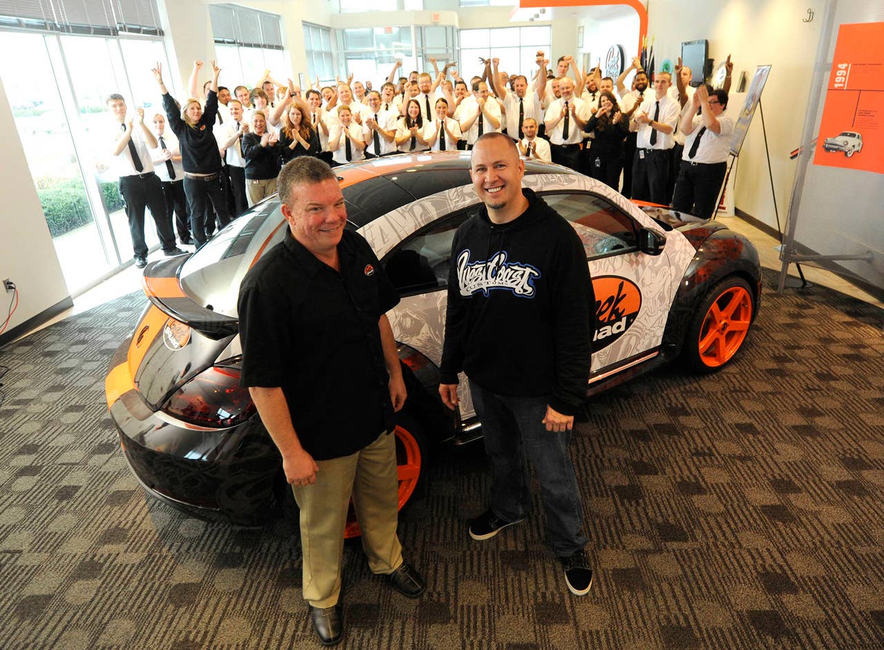 Geek Squad City Mayor Wes Snyder (left) and Scott Voinovich, of West Coast Customs, were on hand for the arrival of a "tricked-out" Geekmobile, at Geek Squad City, Friday, Dec. 7, 2012 in Brooks, Ky., just outside of Louisville. (Photo by Joe Imel/Invision for Best Buy/AP Images)