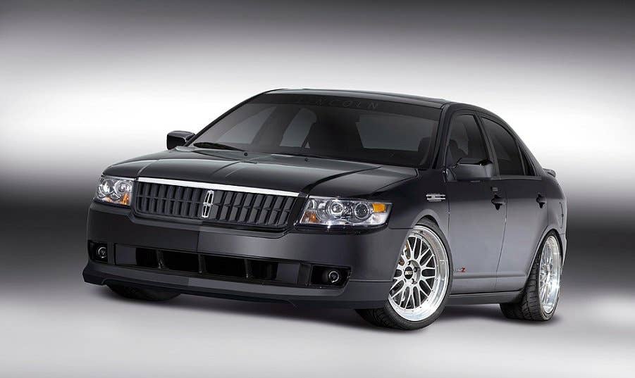 Combine American luxury with European style and handling and you get the Lincoln MKZ by H&R Special Springs. The H&R suspension mods lower the Lincoln nearly three inches over 20-inch Pirelli high-performance tires and O.Z. Botticelli wheels that showcase the Brembo calipers. The 3D Carbon front and rear spoilers are accented with custom fender grilles and bright red MKZ badges. LED under lighting adds to the mood. A full custom interior is accented in Ebony Night microsuede and features a back seat refrigerator and massive Pioneer multimedia system.
