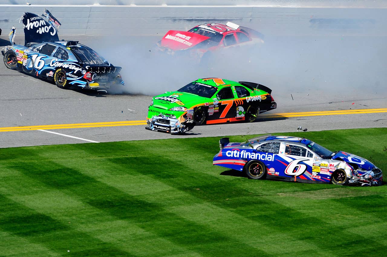 DAYTONA BEACH, FL - FEBRUARY 13:  Danica Patrick, driver of the #7 GoDaddy.com Chevrolet, Colin Braun, driver of the #16 Con-way Freight Ford and Ricky Stenhouse Jr., driver of the #6 CitiFinancial Ford, crash during the NASCAR Nationwide Series Drive4COPD 300 at Daytona International Speedway on February 13, 2010 in Daytona Beach, Florida.  (Photo by Sam Greenwood/Getty Images) *** Local Caption *** Danica Patrick;Colin Braun;Ricky Stenhouse Jr.